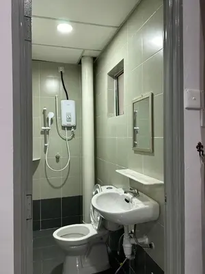 a bathroom with a shower and a toilet and a sink at Forever Green cameron in Brinchang