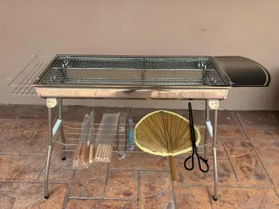 a bird cage sitting on a table with a chair at Comfy21 Homestay Tambun, Ipoh in Ipoh