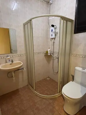 a shower in a bathroom with a toilet and a sink at Comfy21 Homestay Tambun, Ipoh in Ipoh