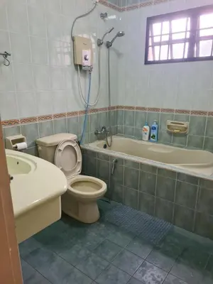 a bathroom with a toilet and a tub and a sink at Comfy21 Homestay Tambun, Ipoh in Ipoh