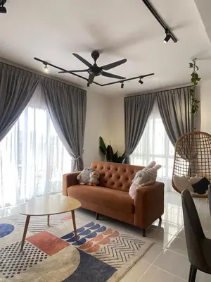 a living room with a couch and a ceiling fan at Chillrex Homestay Just come over Chill & Relax in Brinchang