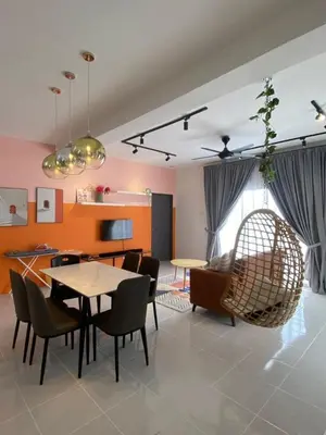 a living room with a table and chairs at Chillrex Homestay Just come over Chill & Relax in Brinchang