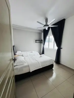 a bedroom with a bed and a ceiling fan at AYAAN PENTHOUSE at QUINTET ROOFTOP BBQ AND DINING with Mini Snookers in Tanah Rata