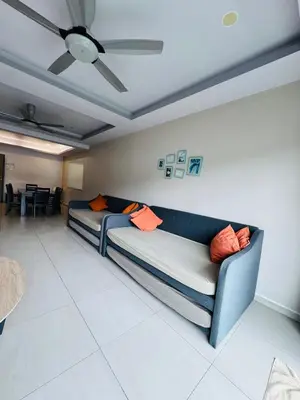 a couch in a living room with a ceiling fan at AYAAN PENTHOUSE at QUINTET ROOFTOP BBQ AND DINING with Mini Snookers in Tanah Rata