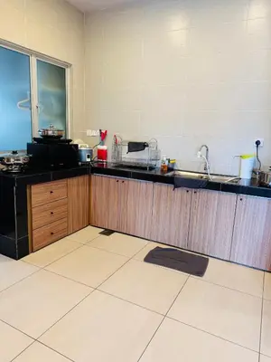 a kitchen with a sink and a counter top at AYAAN PENTHOUSE at QUINTET ROOFTOP BBQ AND DINING with Mini Snookers in Tanah Rata