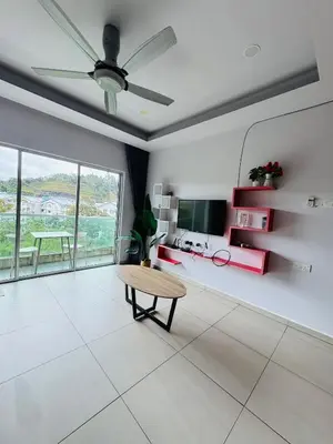 a living room with a table and a tv at AYAAN PENTHOUSE at QUINTET ROOFTOP BBQ AND DINING with Mini Snookers in Tanah Rata