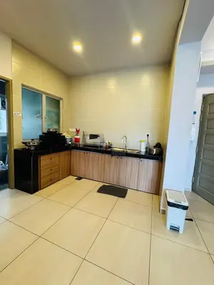 a large kitchen with a sink and a counter at AYAAN PENTHOUSE at QUINTET ROOFTOP BBQ AND DINING with Mini Snookers in Tanah Rata