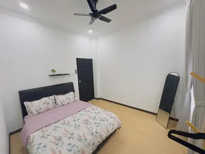 a bedroom with a bed and a ceiling fan at 3Bedroom Landed Cozy Home Ipoh Netflix in Ipoh