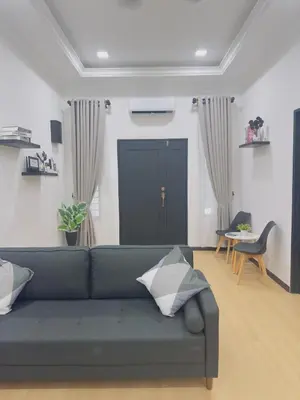 a living room with a couch and a table at 3Bedroom Landed Cozy Home Ipoh Netflix in Ipoh