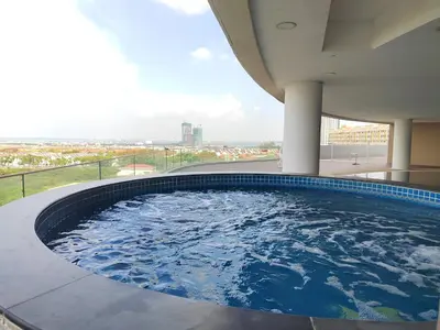 a hot tub on the top of a building at Spacious 1BR 118 Island Plaza 4pax in George Town