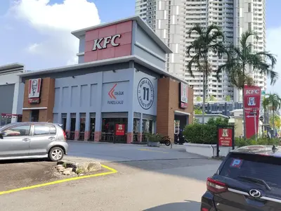 a kfc store with cars parked in front of it at Spacious 1BR 118 Island Plaza 4pax in George Town