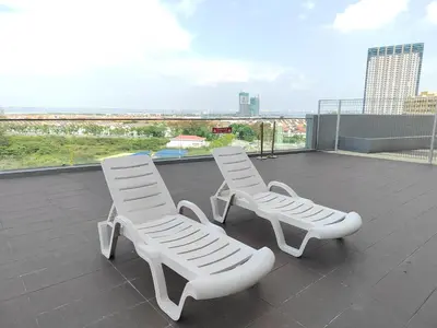 two white chairs sitting on top of a roof at Spacious 1BR 118 Island Plaza 4pax in George Town