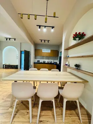 a large dining room with a large table and chairs at AYAAN QUINTET Green Valley with Free Parking in Tanah Rata