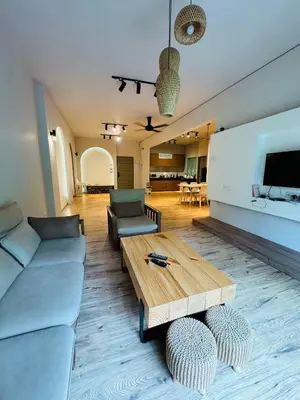 a living room with a couch and a coffee table at AYAAN QUINTET Green Valley with Free Parking in Tanah Rata