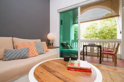 a living room with a couch and a table at Dreame Home by The Quay in George Town