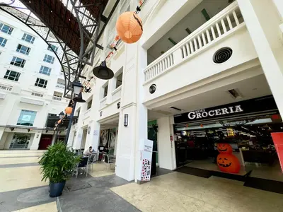 a store front of a shopping mall with a pumpkin sign at Dreame Home by The Quay in George Town