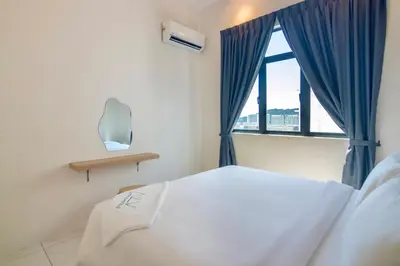 a bedroom with a white bed and a window at The Sun by Stellar ALV in Bayan Lepas