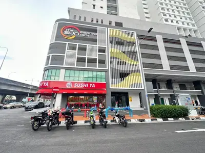 a group of motorcycles parked in front of a building at The Sun by Stellar ALV in Bayan Lepas
