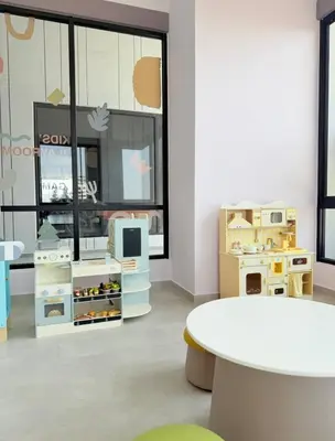 a room with furniture and a table and a window at Iconic Regency by BNB4U in Bayan Lepas
