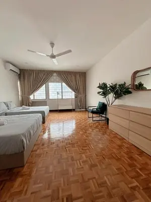 a bedroom with two beds and a ceiling fan at W Home at Jalan Rangoon, George Town Penang in George Town