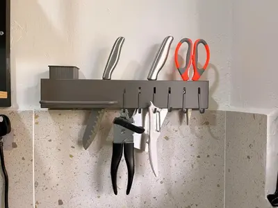 a row of knives and scissors hanging on a wall at \u5b85\u4e00\u8d77 Tonight29 Ipoh City 14Pax SmartTV Netflix 5G in Ipoh