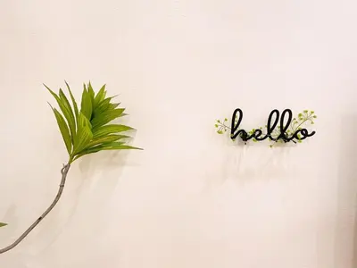 a hello sign on a wall with a plant at \u5b85\u4e00\u8d77 Tonight29 Ipoh City 14Pax SmartTV Netflix 5G in Ipoh