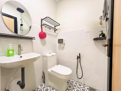 a white bathroom with a toilet and a sink at \u5b85\u4e00\u8d77 Tonight29 Ipoh City 14Pax SmartTV Netflix 5G in Ipoh