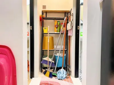 a hallway with a broom and other cleaning supplies at \u5b85\u4e00\u8d77 Tonight29 Ipoh City 14Pax SmartTV Netflix 5G in Ipoh