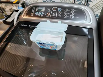 a plastic container sitting on top of a toaster oven at The Anderson Ipoh AA1 Smart TV & 5G WiFi ready in Ipoh