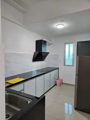 a kitchen with a black counter top and a sink at New Metropol 3 Bedrooms Pool View in Bukit Mertajam
