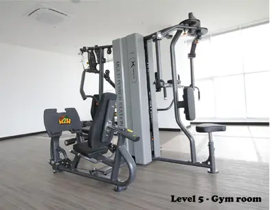 a gym with a cardio machine and a treadmill at ICC Suites Ipoh 202A by H2H in Ipoh