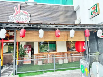 a restaurant with red lanterns on the front of it at Kinta River Town Suites By IWH in Ipoh