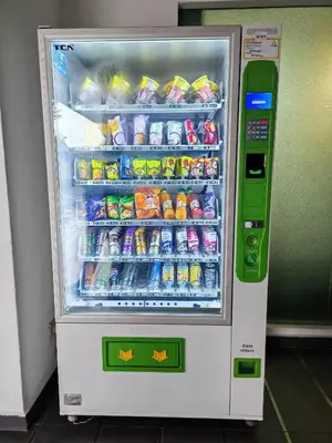 a refrigerator filled with drinks and soda at Kinta River Town Suites By IWH in Ipoh