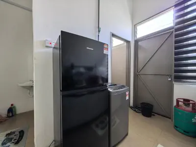 a black refrigerator with a television on top of it at Suite Karangan Near Inokom in Titi Karangan