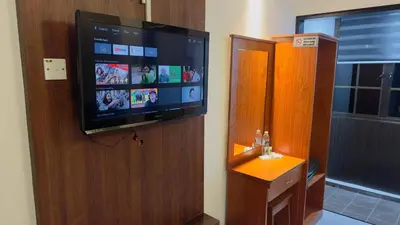 a flat screen tv on the wall of a room at D GAYA HOTEL Cameron Highlands in Tanah Rata