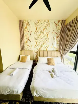 two beds in a room with a wall at Jac Urban Suites Luxury & Premium Staycation 10pax in George Town