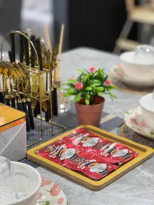 a table with a plate on a table with plates at Jac Urban Suites Luxury & Premium Staycation 10pax in George Town