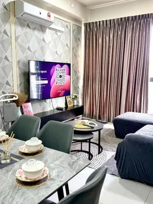 a living room with a table and chairs and a tv at Jac Urban Suites Luxury & Premium Staycation 10pax in George Town