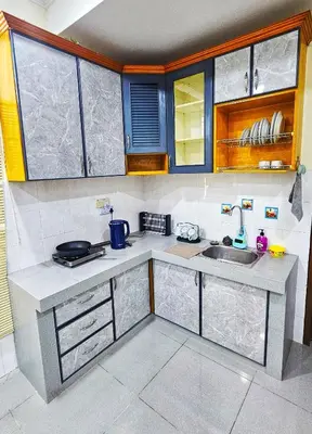 a kitchen with a sink and a counter top at Venice Manjung, Lumut by TZ Homestay in Lumut