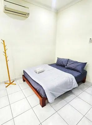 a bedroom with a bed in a room at Venice Manjung, Lumut by TZ Homestay in Lumut
