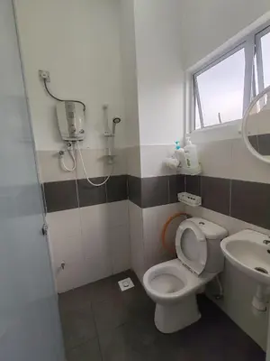 a bathroom with a toilet and a sink at ZE VI Homestay,Tanah Rata in Tanah Rata