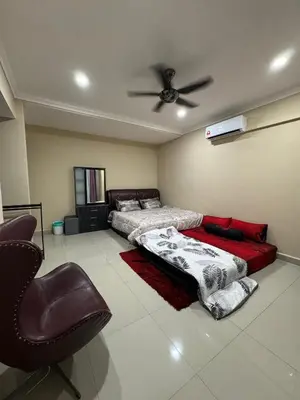 a bedroom with two beds and a ceiling fan at Utaqha Ventures Homestay in Seri Manjung