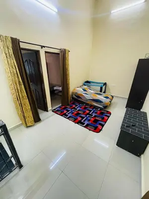 a room with two rugs on the floor next to a door at Utaqha Ventures Homestay in Seri Manjung