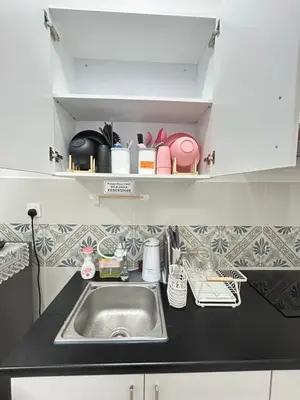 a kitchen with a sink and a counter top at CT Hillcrest Loft Ipoh in Ipoh