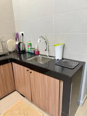 a kitchen counter top with a sink and a counter top at AYAAN GAMING HOME at Quintet Play Free GranTurismo in Tanah Rata