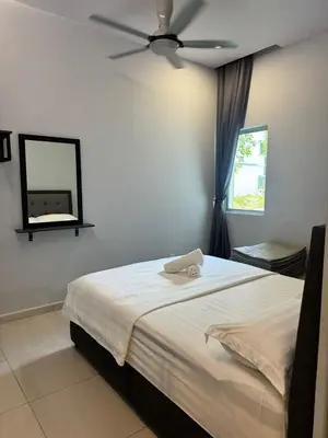 a bedroom with a bed with a ceiling fan at AYAAN GAMING HOME at Quintet Play Free GranTurismo in Tanah Rata