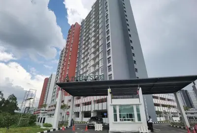 a large tall building with a parking lot in front of it at Arrisa Guest House d'Anderson Ipoh Perak in Kampong Kepayang