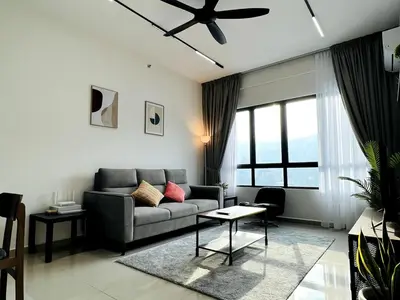 a living room with a couch and a ceiling fan at Sunshine Residence Kekloksi View 2R 4pax in Ayer Itam