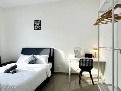 a white bedroom with a bed and a desk at Sunshine Residence Kekloksi View 2R 4pax in Ayer Itam