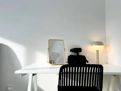 a white table with a mirror and a black chair at Sunshine Residence Kekloksi View 2R 4pax in Ayer Itam
